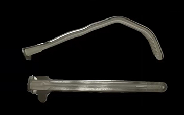 Two views of a surgical retractor on a a black background