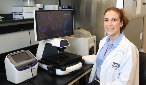 A photograph of Kaitlyn Sadtler in a laboratory