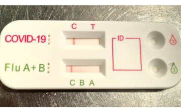 Photograph of a multiplex COVID-19/flu rapid antigen test