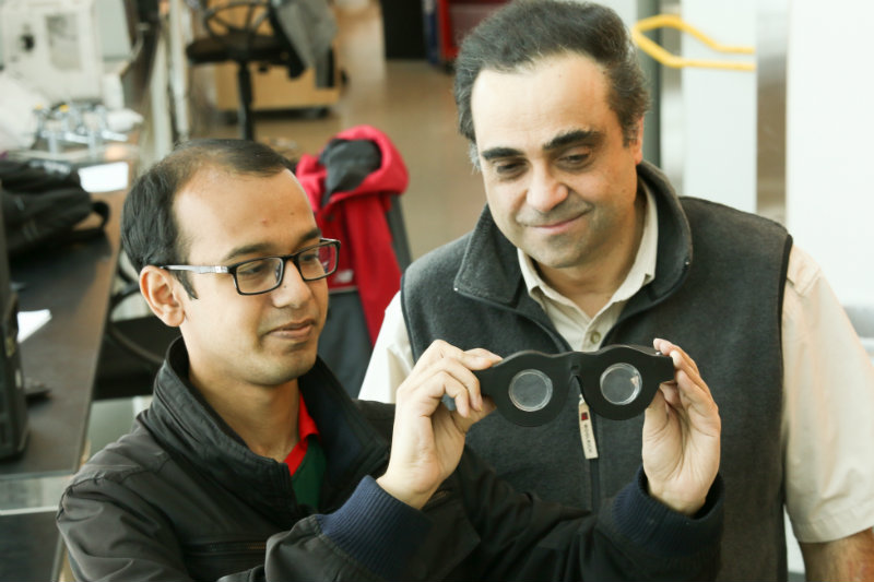 Mastrangelo, right, and doctoral student Nazmul Hasan holding smart glasses