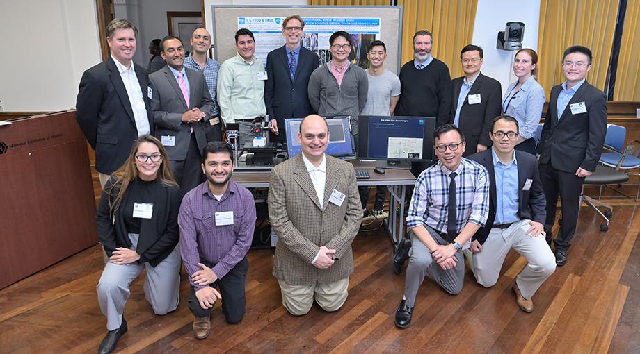 NIBIB Director Bruce Tromberg poses with the NIBIB grantees participating in the technology demonstrations for congressional staff visiting NIBIB. Front row L-R: Sara Van Belleghem, Bhushan Mahadik, Abbas Sohrabpour, Wilbur Lam, Robert Mannino. Back row L-R: John Fisher, Srikanth Vasudevan, Mohsen Erfanzadeh, Guillermo Monroy, Bruce Tromberg, Michael Tao, Kasey Kwong, Daniel Hammer, Bin He, Kaitlyn Sadtler, and Guang Yang.