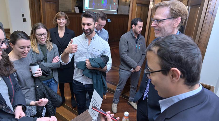 Congressional staff try out an app developed by NIBIB grantees that measures hemoglobin in the fingernails. A thumbs up indicates this participant does not have anemia.