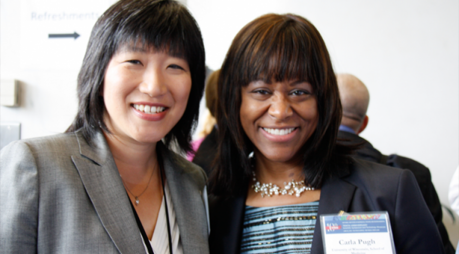 Dr. Grace Peng (on left), NIBIB Program Director, with Dr. Carla Pugh, an NIBIB-funded researcher and Presidential Early Career Award (PECASE) recipient and speaker at the NIBIB Scientific Symposium.