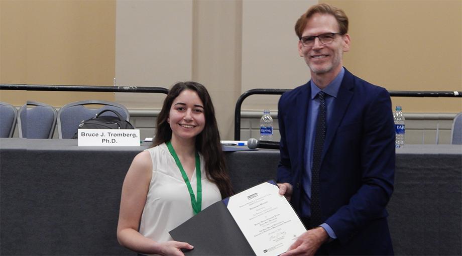 Mia Saade, Columbia University is awarded a Honorable Mention by Dr. Bruce Tromberg for her team’s device to detect subclinical mastitis in breastfeeding mothers.