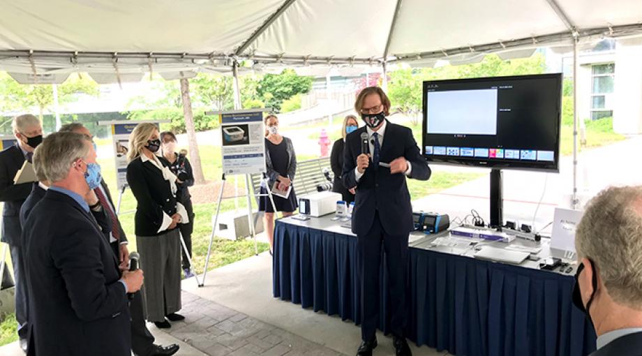 NIBIB Director Bruce Tromberg demonstrates the Ellume COVID-19 antigen test developed with support from NIH RADx Tech/ATP. (NIBIB photo)