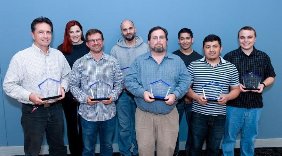 IDEAS staff holding 2018 CIT/OCIO Mentoring Award for our group's extensive mentoring program. From left to right: Tom Pohida (Section Chief), Raisa Freidlin, John Kakareka, Ghadi Salem, Randy Pursley, Javier Mendez, Marcial Garmendia, Jonathan Krynitsky.