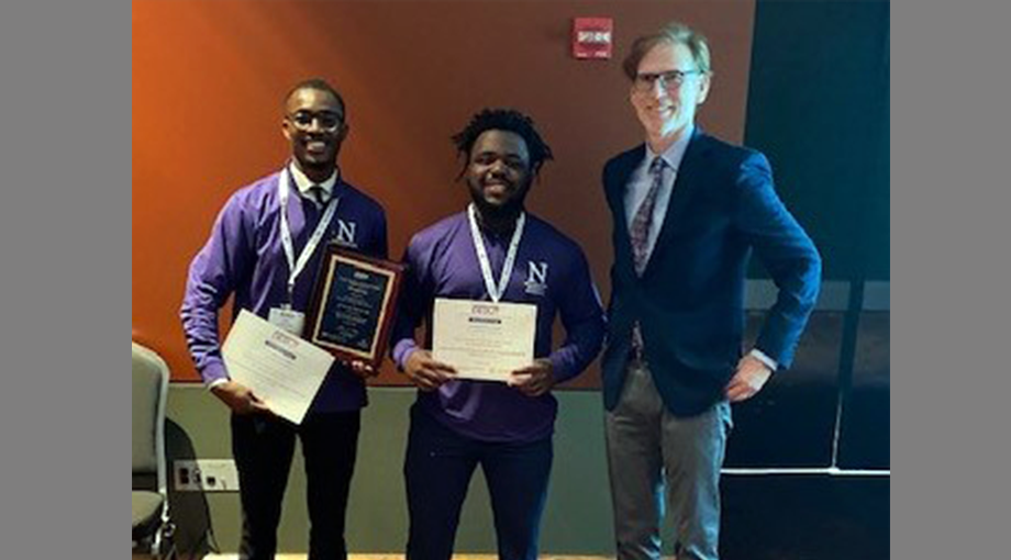 Team POCAS-TB of Northwestern University, winners of the HIV/AIDS Prize ($15,000) provided by the NIH Office of AIDS Research. Left to right: Peter Kouassi, Isaac Tenga, and Dr. Bruce Tromberg. Team member not pictured, Shani Katz.