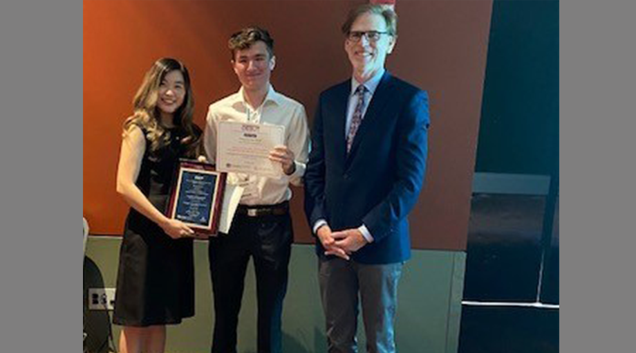 Team Ampliphage of Stanford University, winners of the Second Place Prize ($15,000) provided by NIBIB. Left to right: Michelle Shen, Chris Neimeth, and Dr. Bruce Tromberg. Team members not pictured, Alex Bradfield and Karsten Householder.