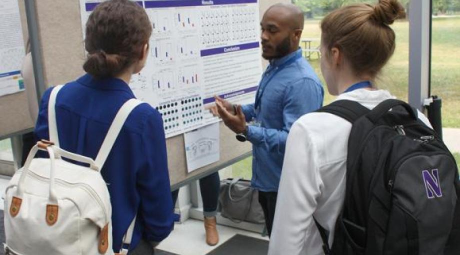 Marsalis Smith, Northwestern University, presents a poster during the Poster Session