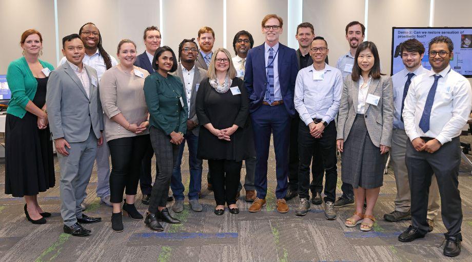 NIBIB Director Bruce Tromberg and NIBIB Deputy Director Jill Heemskerk pose with the NIBIB grantees participating in the technology demonstrations. Front row L-R: Wilbur Lam, Erika Tyburski, Sandhya Vasudevan, Idris Sunmola, Jill Heemskerk, Bruce Tromberg, Michael Kam, He (Helen) Huang, and Varun Nalam. Back row L-R: Julie Sullivan, Manu Platt, Daniel X. Hammer, William Vogt, Anant Agrawal, Axel Krieger, Justin Opfermann, and Brendan Driscoll.